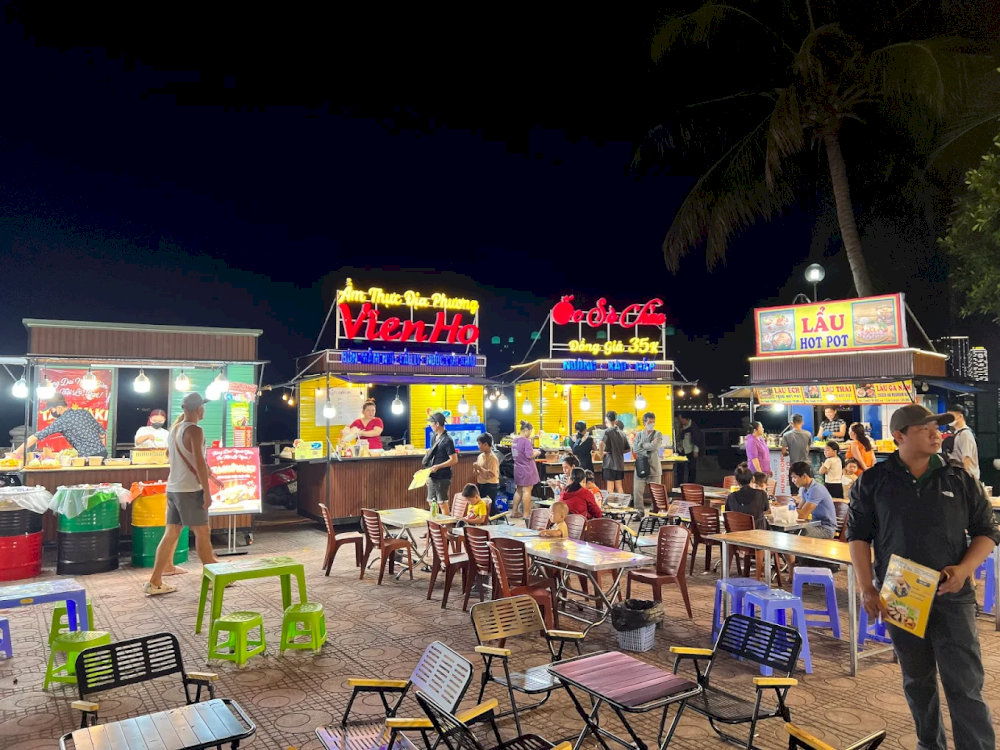 Eating at street-side stalls with tiny tables and chairs packed closely together is an incredibly unique experience